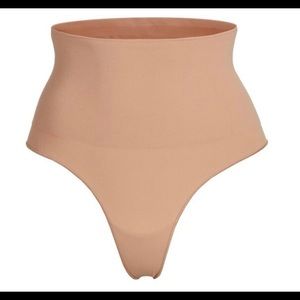 SKIMS CORE CONTROL THONG IN OCHRE
